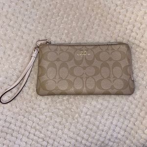 Coach signature print double zip wallet.